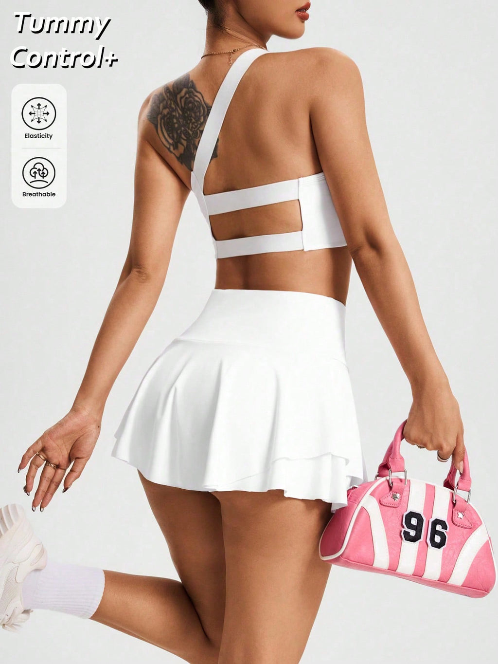 Conjunto Deportivo Asimétrico con Falda-Shorte – Elegancia y Dinatismo
